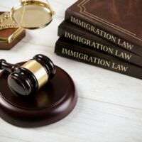 Immigration law book with judges gavel