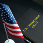 US citizenship exam test and USA flag. US citizenship exam test and USA flag.